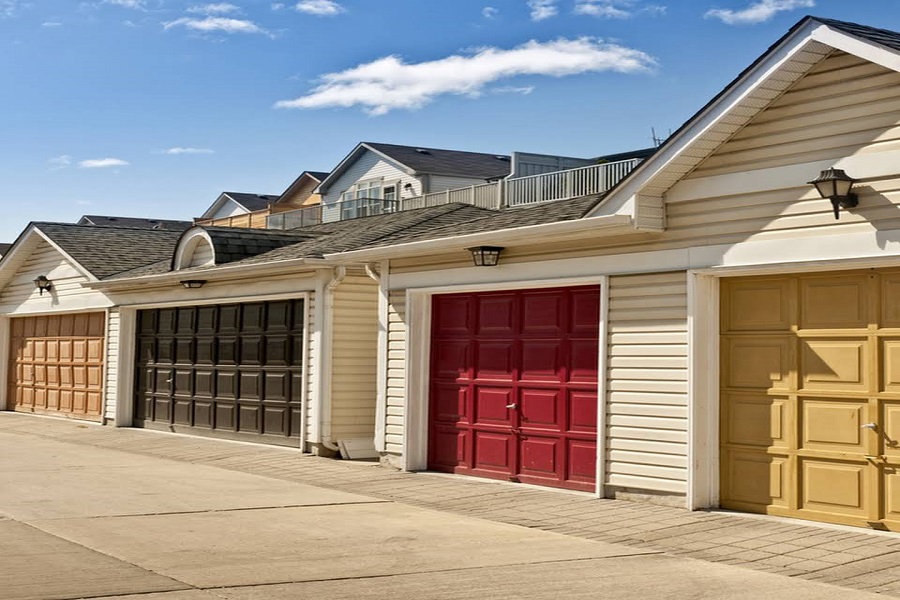 Row of houses with colorful garage doors