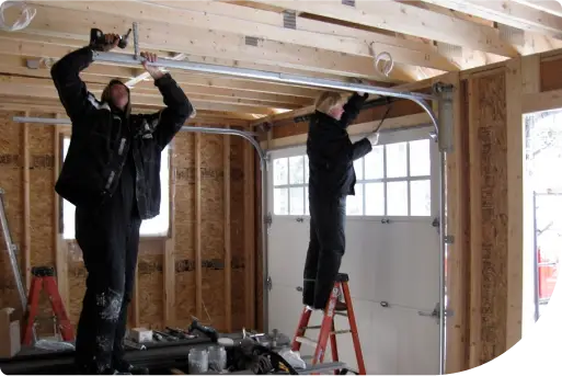 Technicians installing a new garage door