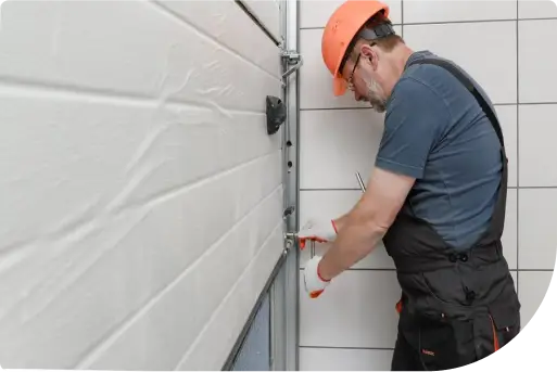 Technician fixing a garage door