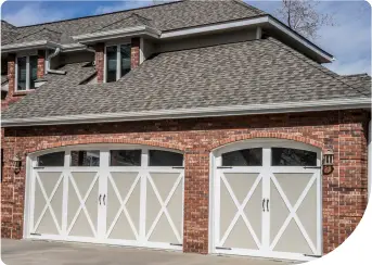 Carriage House garage doors on a brick home